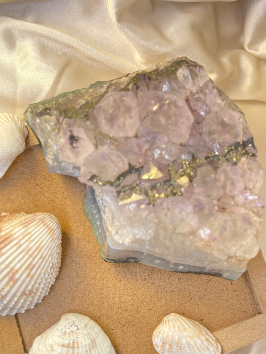 Amethyst cluster with pyrite inclusions